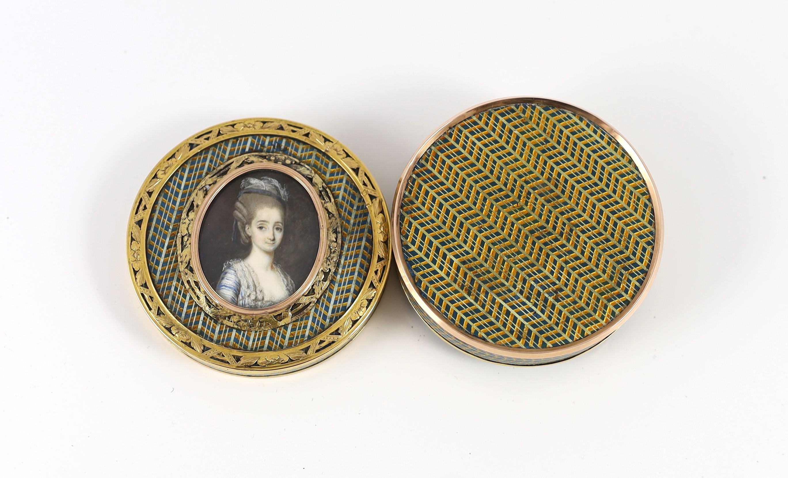 A late 18th century tortoiseshell boîte-à-miniature, the cove decorated with an inset portrait miniature of a young lady, mounted with pierced yellow metal borders 7.5cm diameter